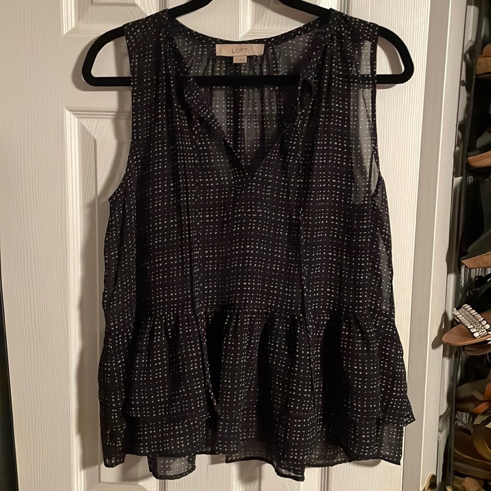 Navy blue and white sleeveless blouse